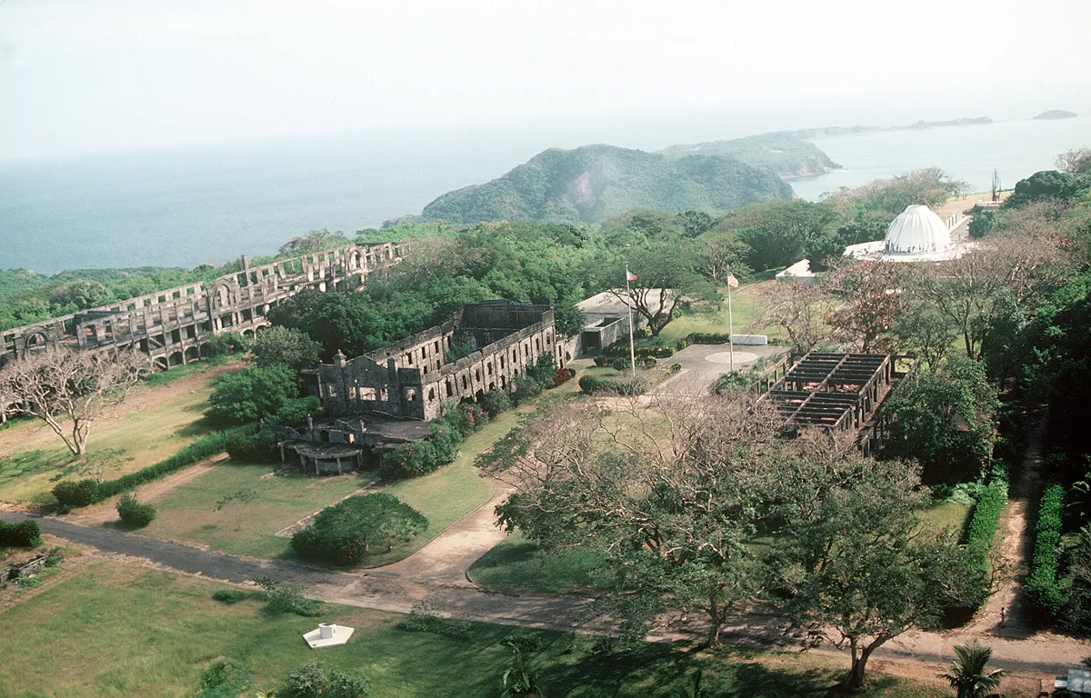 Aerial view of the ruins and a memorial to American defenders of Corregidor island during World War II.