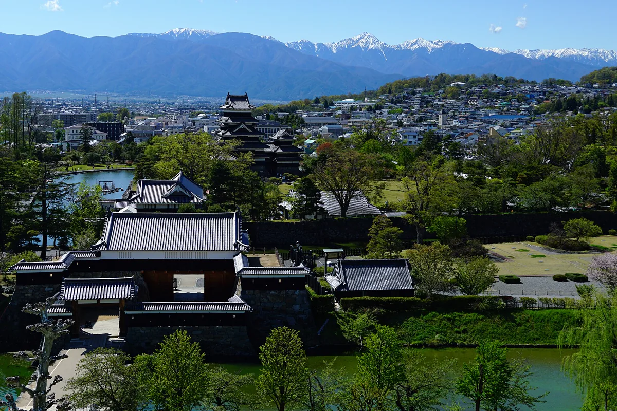 Matsumoto Castle and Hida Mountains in Matsumoto , Nagano prefecture , Japan